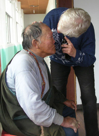 Dr. Ray examining the eyes of a local Tibetan patient